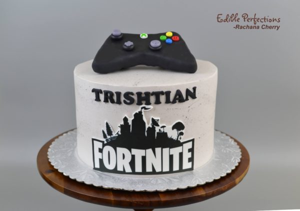 A Fortnite birthday cake I worked on, it was a fun mix of buttercream  drawing and fondant work! (Detail shots included) : r/cakedecorating